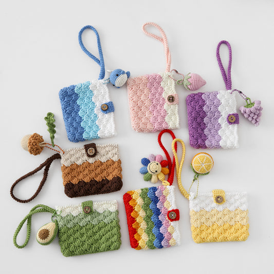 Collection of colorful crocheted pouches with various designs