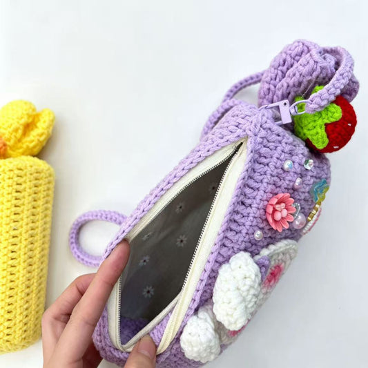Colorful crocheting pouch with floral decorations 