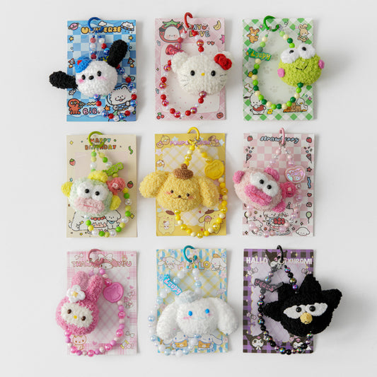 Collection of cute crochet sanrio keychains in packaging 