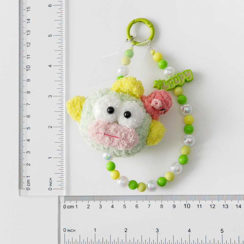 Colorful sanrio fishman keychain with a ruler for refer size